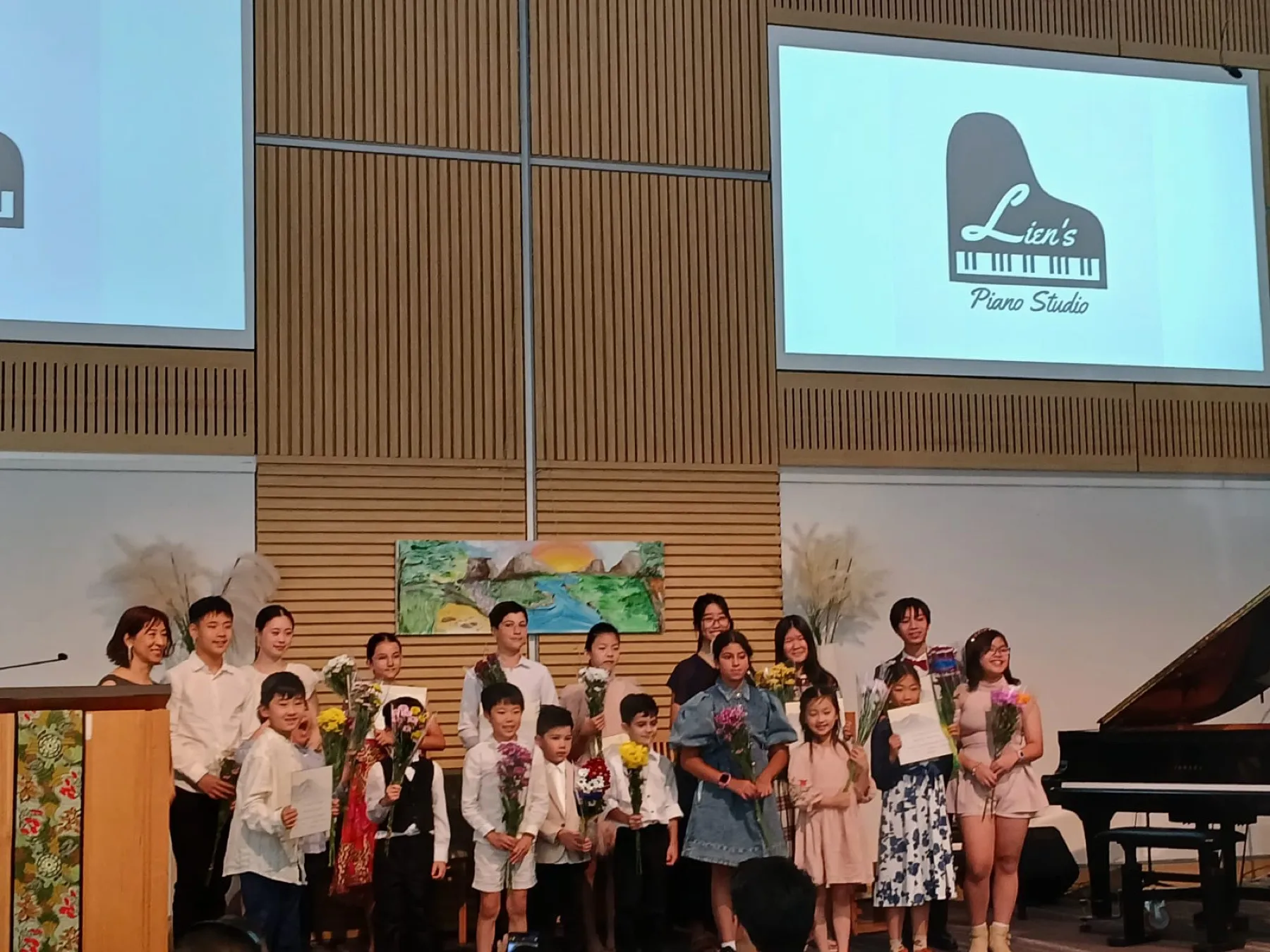 Annual student recital — flowers, certificates and family